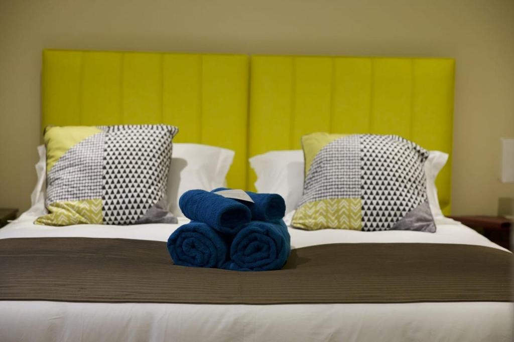 Un pat sau paturi într-o cameră la Tu Guesthouse
