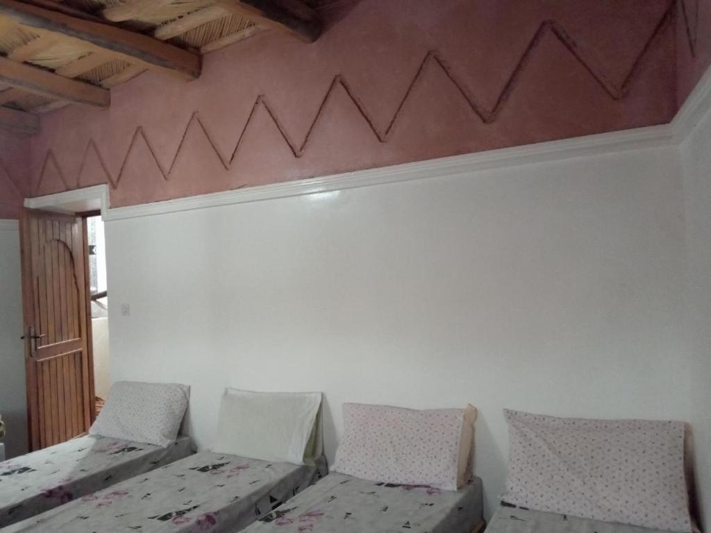 Postel nebo postele na pokoji v ubytování Gîte Assafar