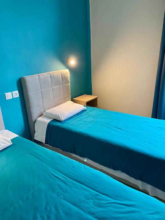 Postel nebo postele na pokoji v ubytování Hotel Kastoria