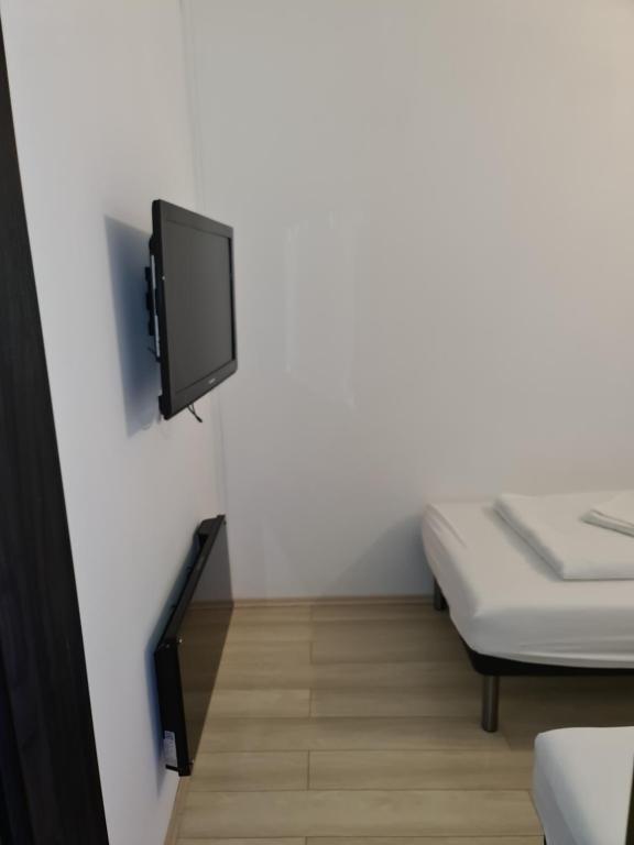 Telewizja i/lub zestaw kina domowego w obiekcie Smaragd apartman