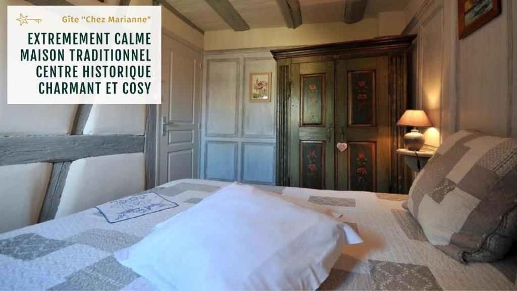 Säng eller sängar i ett rum på Gite Chez Marianne