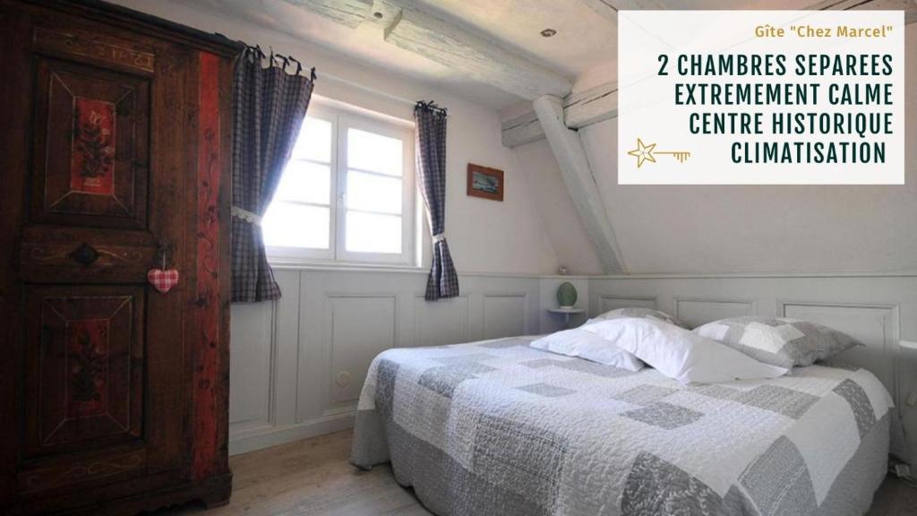 Säng eller sängar i ett rum på Gite Chez Marcel