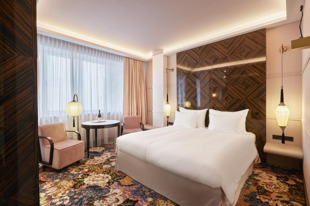 Postel nebo postele na pokoji v ubytování Hotel Topazz & Lamée
