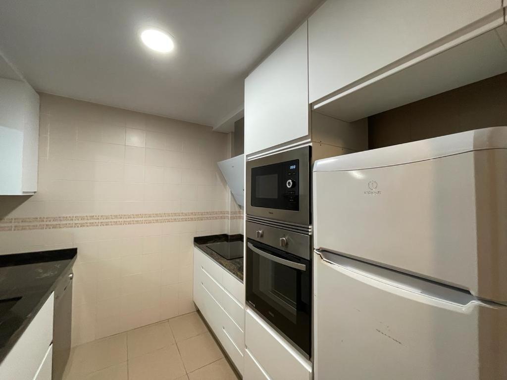 A kitchen or kitchenette at Apartamento Edificio Coral