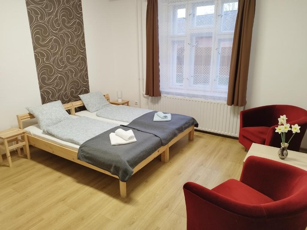 Łóżko lub łóżka w pokoju w obiekcie Tartós Szegfű Vendégház, Magánszállás