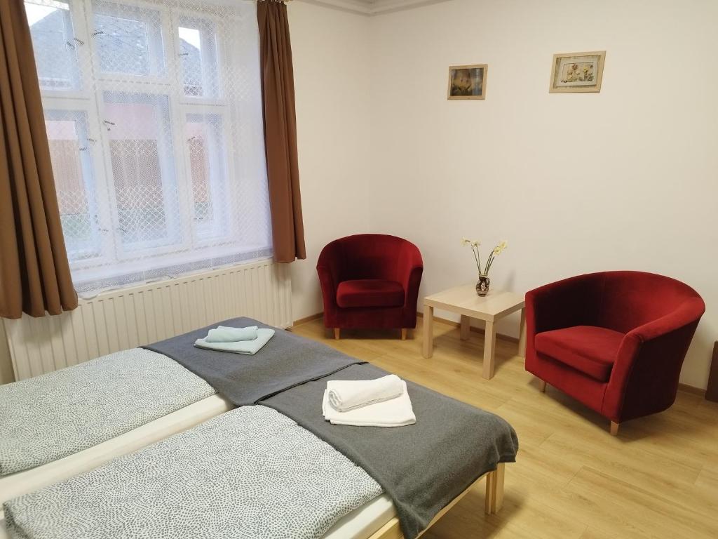 Łóżko lub łóżka w pokoju w obiekcie Tartós Szegfű Vendégház, Magánszállás
