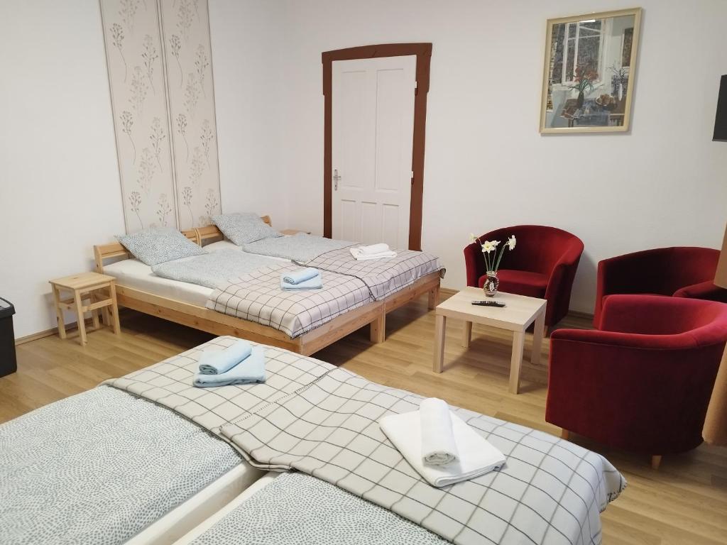 Łóżko lub łóżka w pokoju w obiekcie Tartós Szegfű Vendégház, Magánszállás