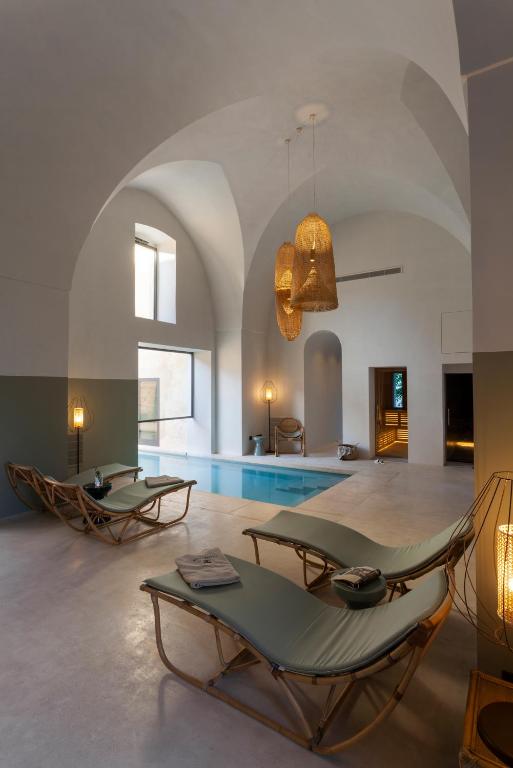 TV a/nebo společenská místnost v ubytování Palazzo Tafuri Boutique Hotel
