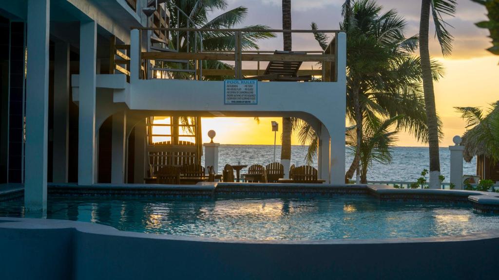 a house with a swimming pool in front of the ocean at Corona del Mar in San Pedro