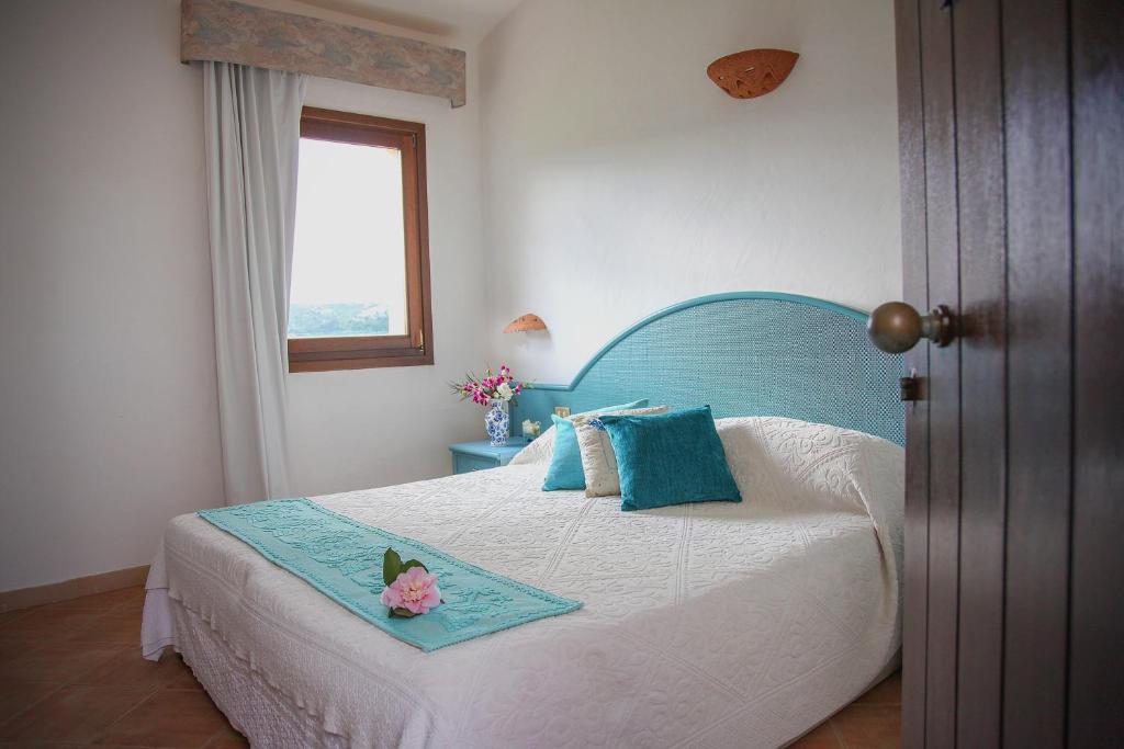 Postel nebo postele na pokoji v ubytování Hotel Micalosu