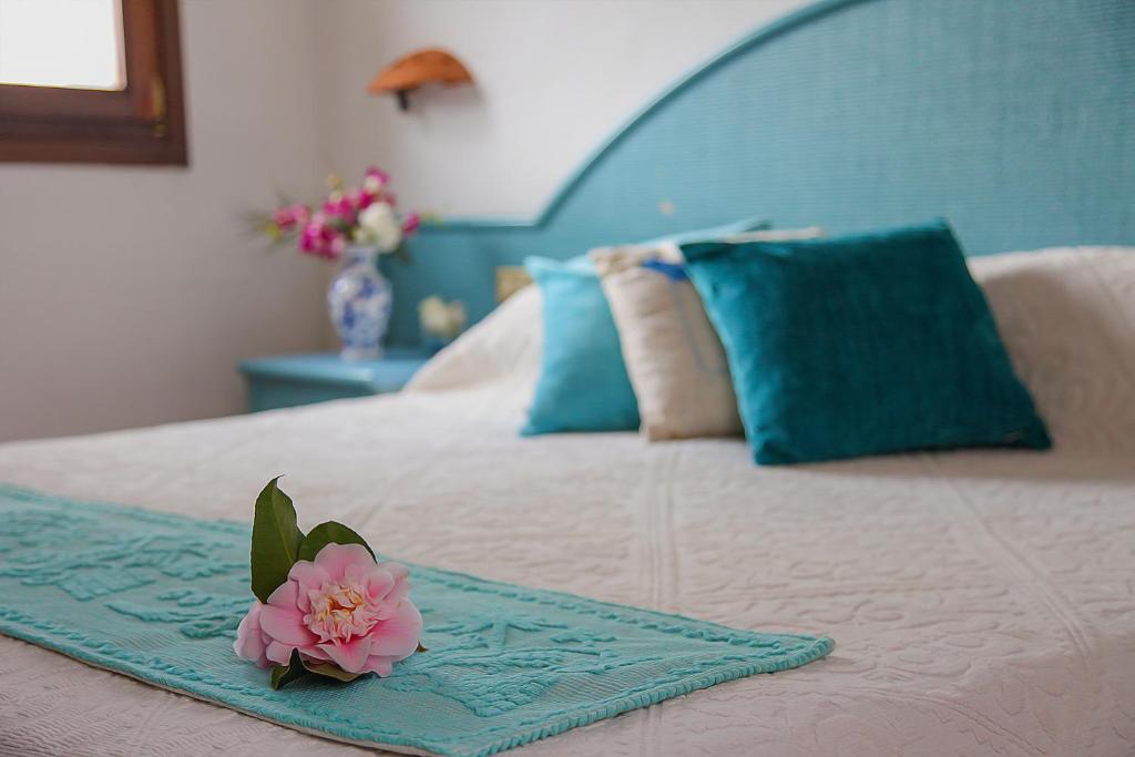 Postel nebo postele na pokoji v ubytování Hotel Micalosu