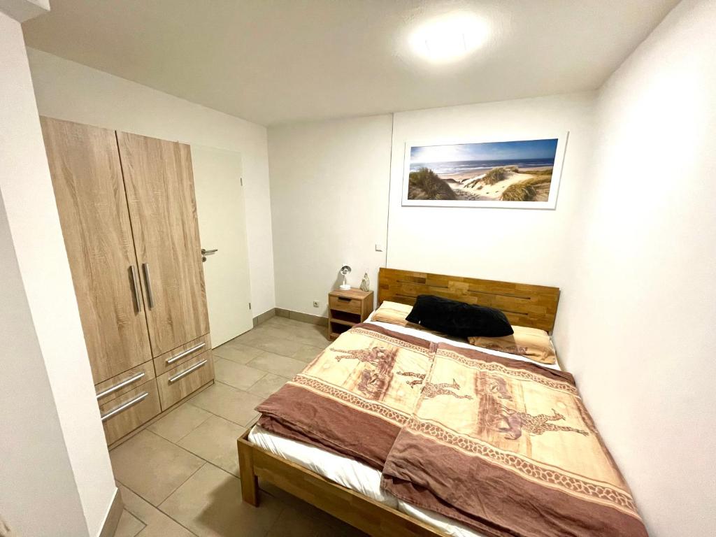 Postel nebo postele na pokoji v ubytování Apartment Uferpromenade Steuerboard