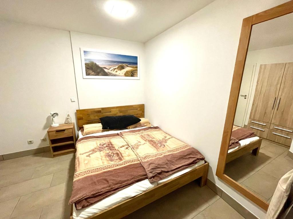 Postel nebo postele na pokoji v ubytování Apartment Uferpromenade Steuerboard