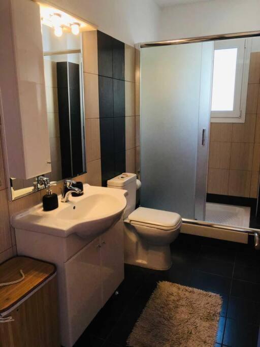 A bathroom at Barbati balcony view
