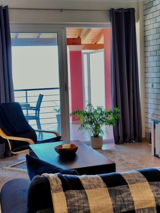 A seating area at Barbati balcony view