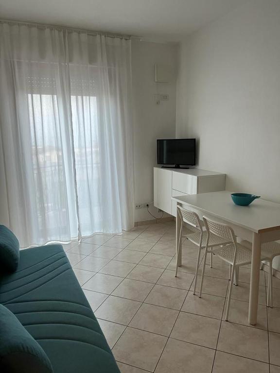 A television and/or entertainment centre at Al Mare apartment