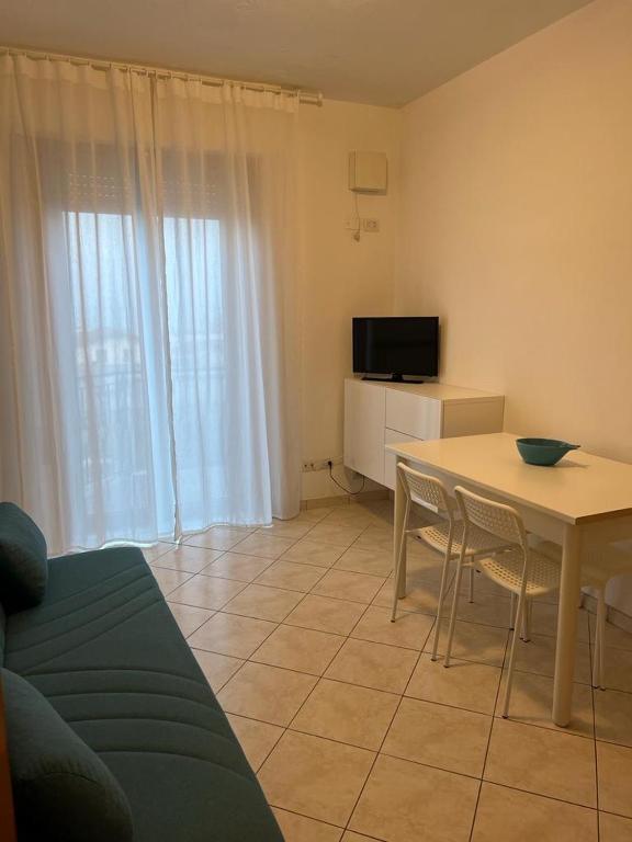 A television and/or entertainment centre at Al Mare apartment