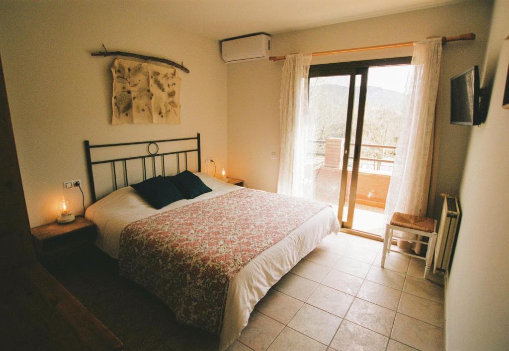 Postel nebo postele na pokoji v ubytování Hostal de l'Aigua