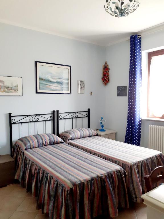 Postel nebo postele na pokoji v ubytování La Casa Più Sù