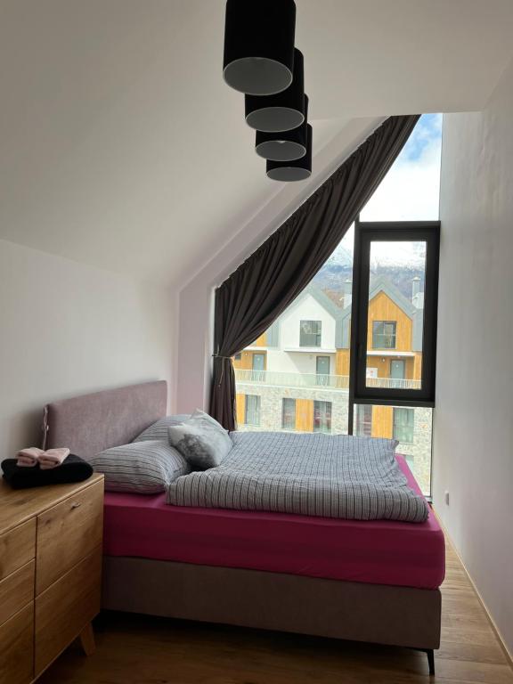 Ένα ή περισσότερα κρεβάτια σε δωμάτιο στο Apartmán Brezy