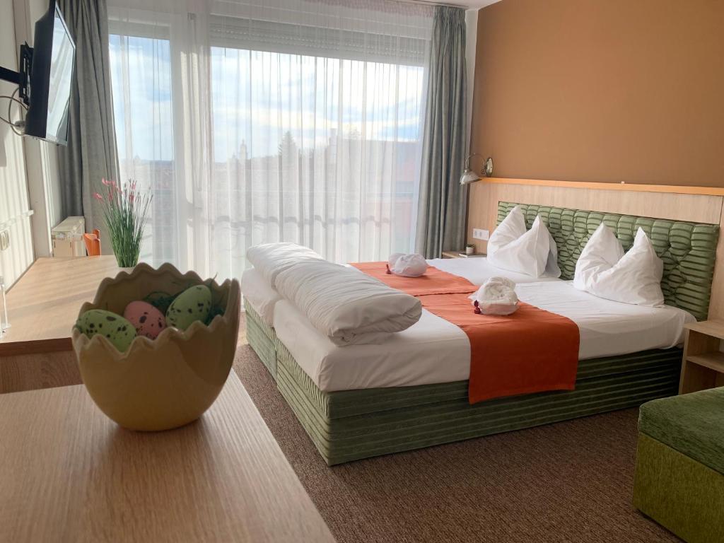 Postel nebo postele na pokoji v ubytování Várfal Wellness Panzió