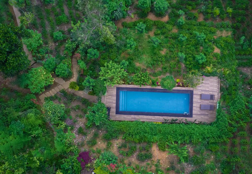 an overhead view of a building with a swimming pool at Tea Cabins in Ella