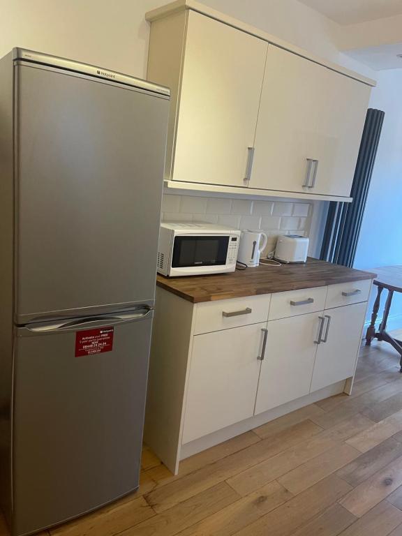 Kuchyň nebo kuchyňský kout v ubytování Room in Gloucester Road 4