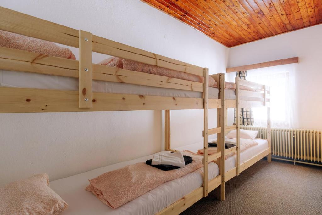 Postel nebo postele na pokoji v ubytování Chata pod Sedlom Čertovica