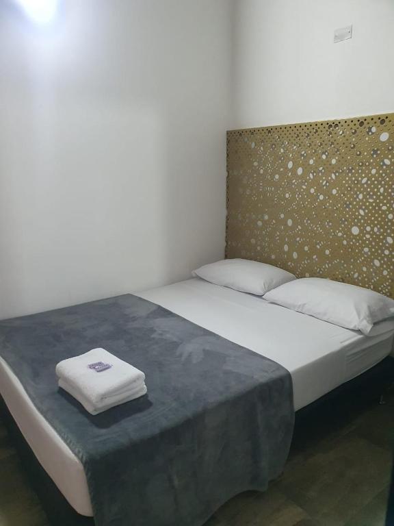Postel nebo postele na pokoji v ubytování Hotel Prestige
