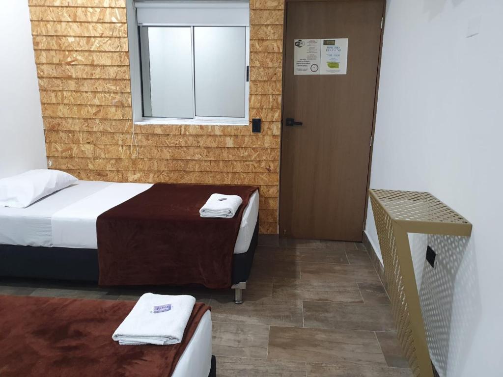 Postel nebo postele na pokoji v ubytování Hotel Prestige