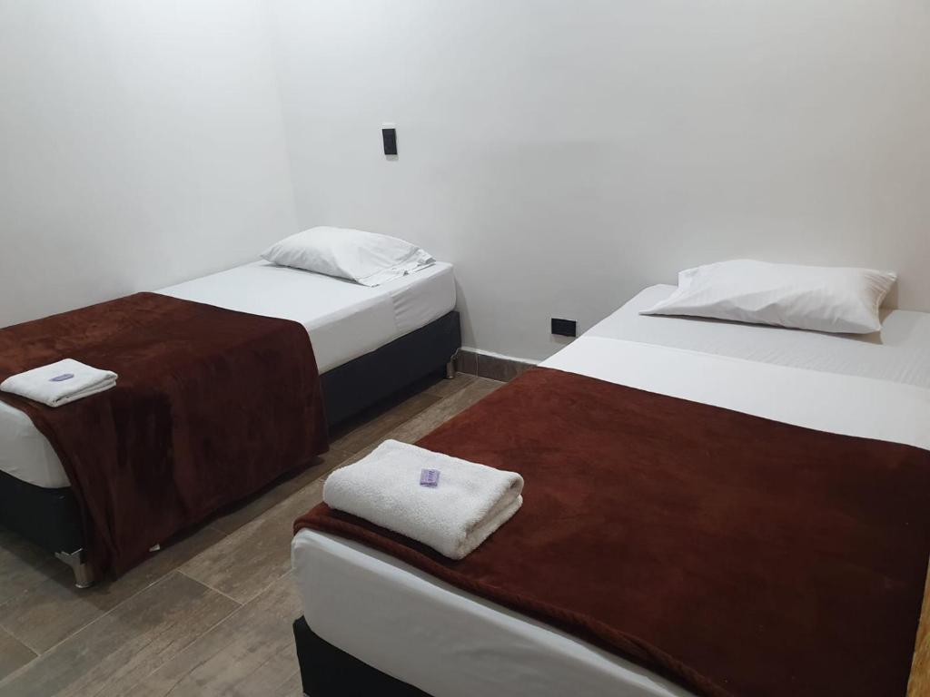 Postel nebo postele na pokoji v ubytování Hotel Prestige