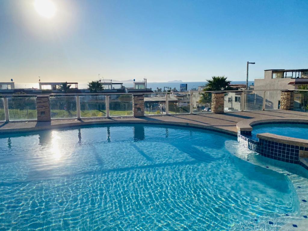 Holiday home Walk to the Beach! 2 Bed Townhome with Pool & View