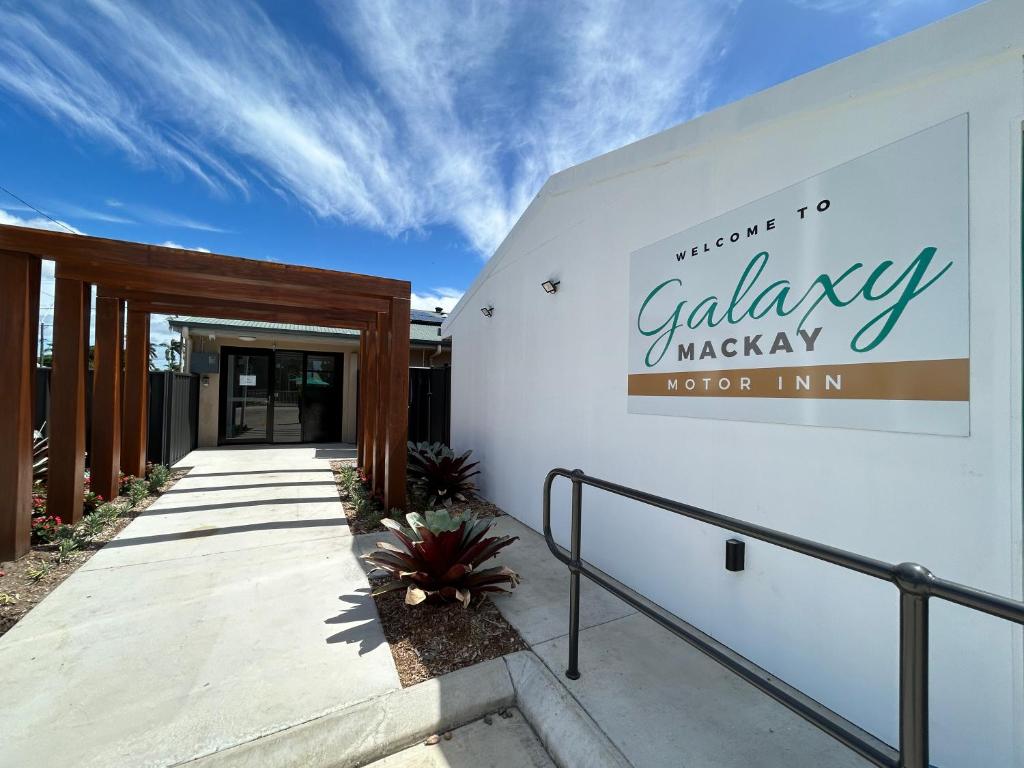 a sign for the entry to a calavisagencyagency sign in a building at Galaxy Mackay Motor Inn in Mackay