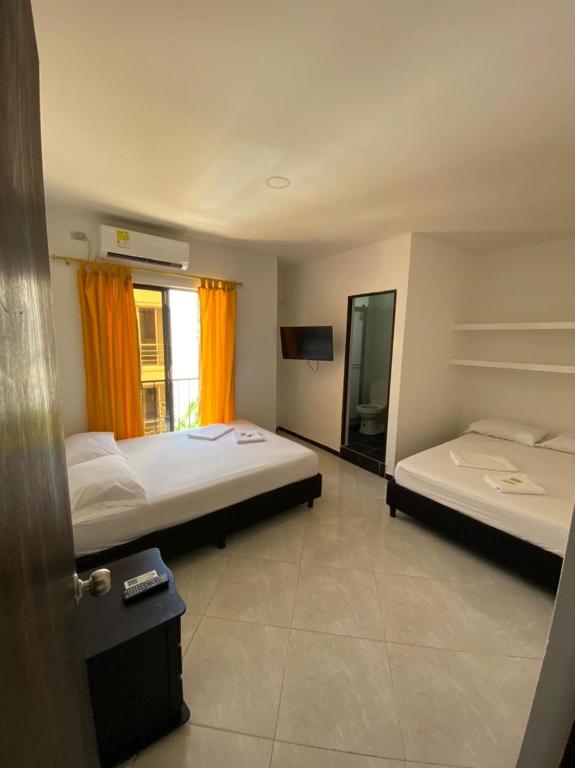 Postel nebo postele na pokoji v ubytování Hotel SG