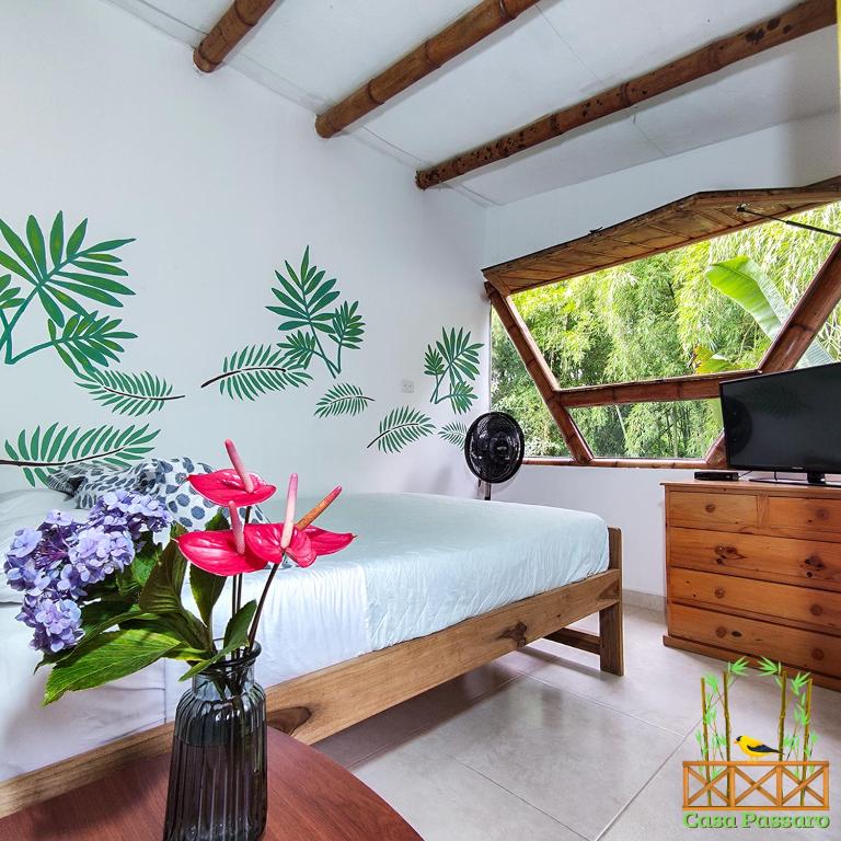 Una cama o camas en una habitación de Casa Passaro