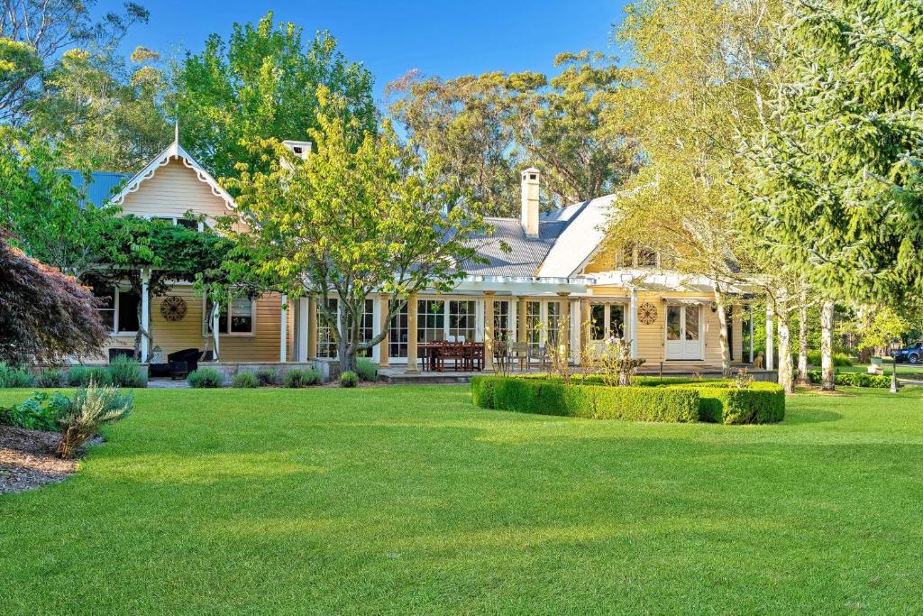 a house with a lawn in front of it at Glen Regan Berrima in Berrima