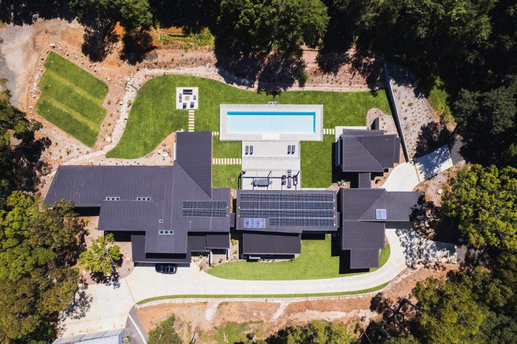 an aerial view of a house with a swimming pool at Launa Killcare Heights in Killcare