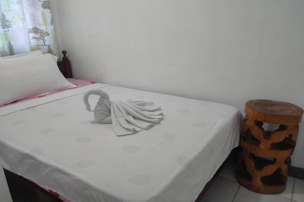 Postel nebo postele na pokoji v ubytování Istroberi Inn Palawan near Airport