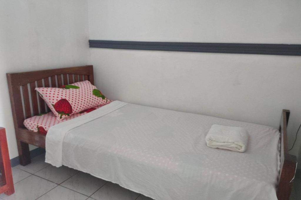 Postel nebo postele na pokoji v ubytování Istroberi Inn Palawan near Airport