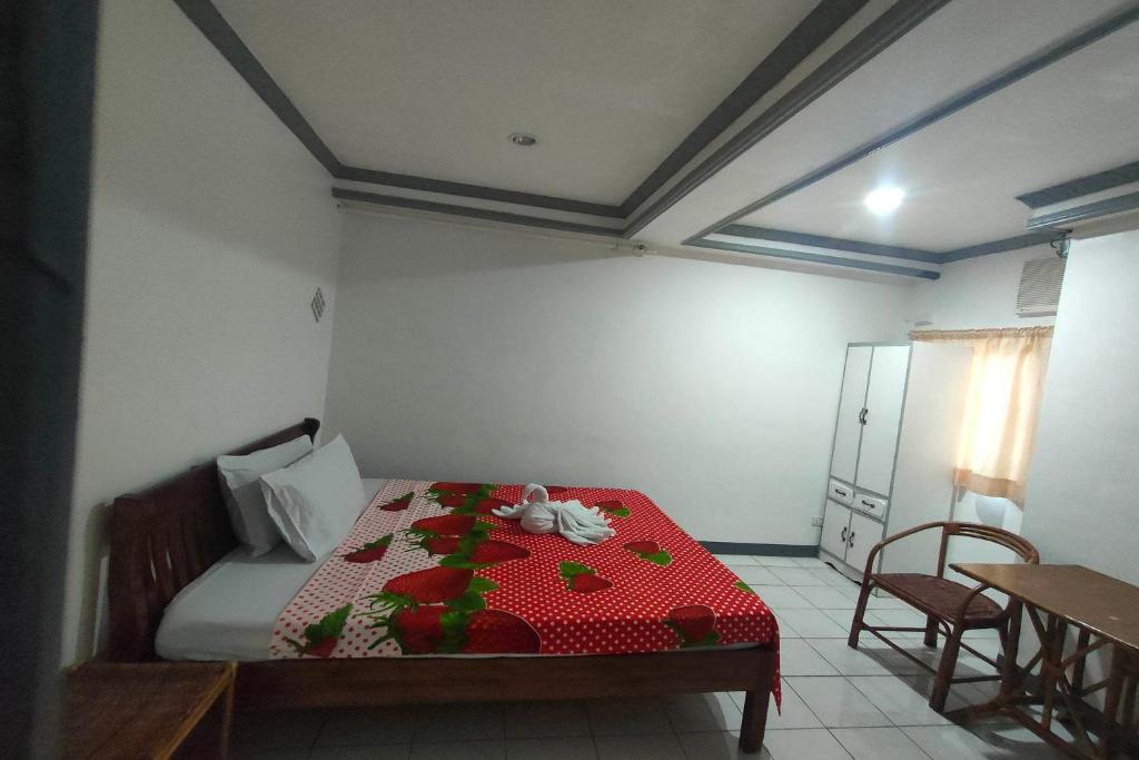 Postel nebo postele na pokoji v ubytování Istroberi Inn Palawan near Airport