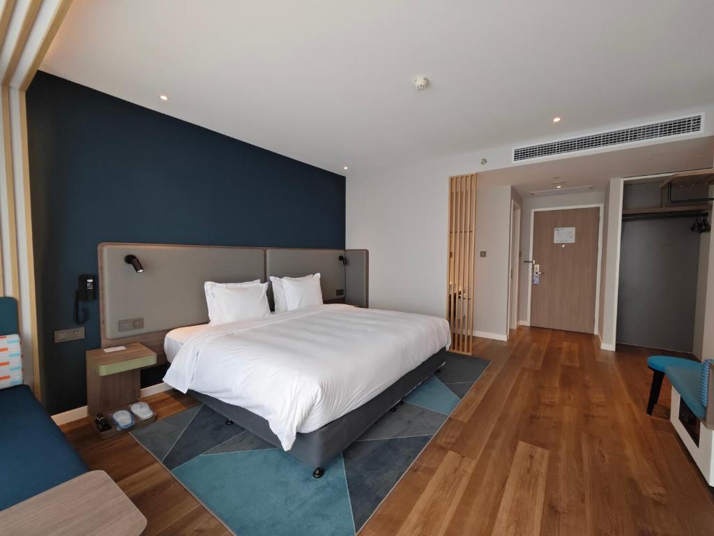 Postel nebo postele na pokoji v ubytování Holiday Inn Express Shanghai Qingpu New City by IHG