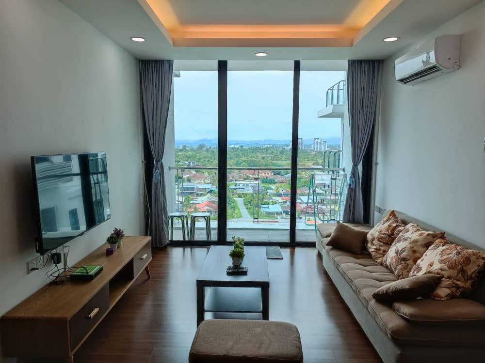 a living room with a couch and a large window at A.Foo Homestay 4.0 @ Vivacity Megamall Jazz Suite 4 in Kuching