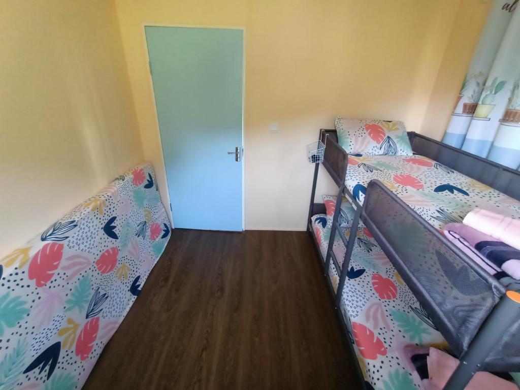 Postel nebo postele na pokoji v ubytování Kundasang Trail Homestay