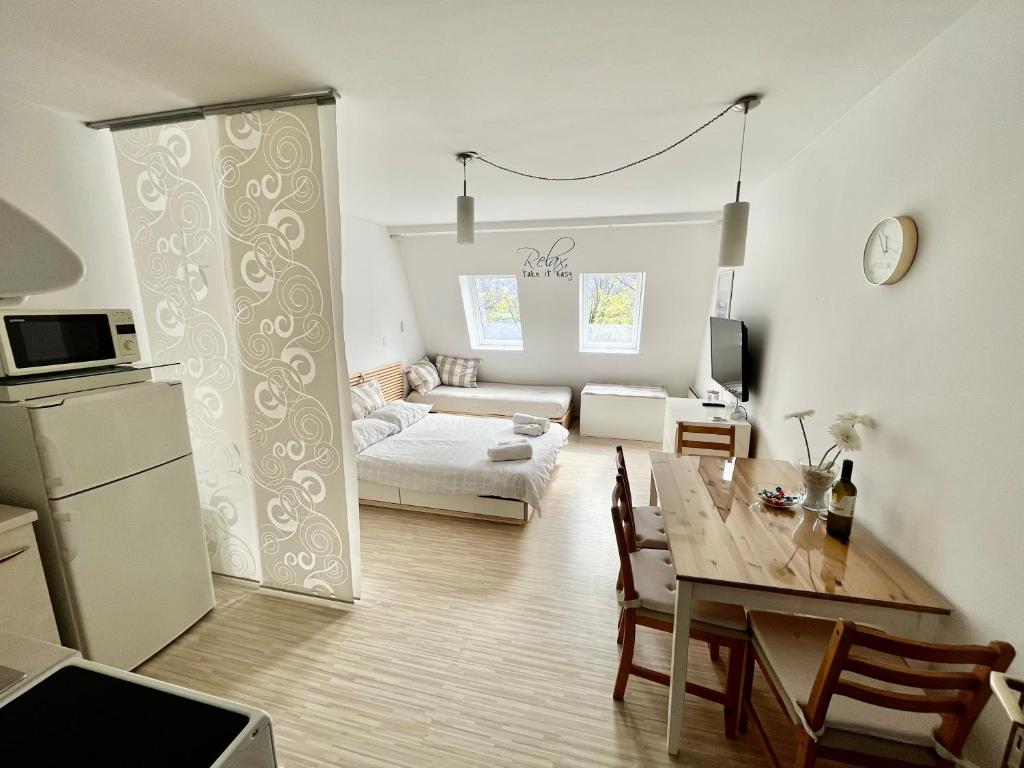 a living room with a table and a dining room at Apartment TiSa, Bovec in Bovec