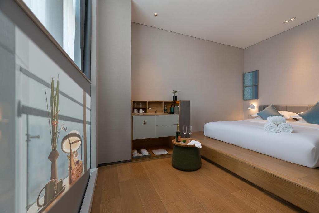 Postel nebo postele na pokoji v ubytování Pagoda Hotel Shenzhen