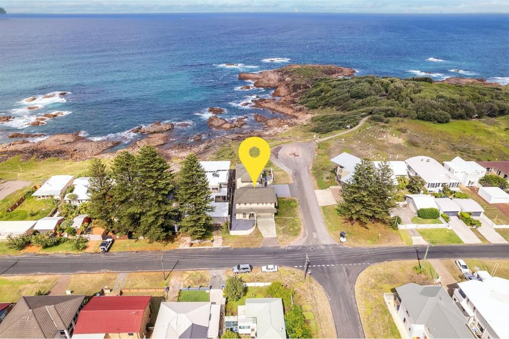 an aerial view of a road with a yellow marker at Ocean View Anna Bay in Anna Bay
