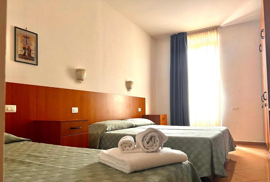 Posteľ alebo postele v izbe v ubytovaní Nazareth Residence