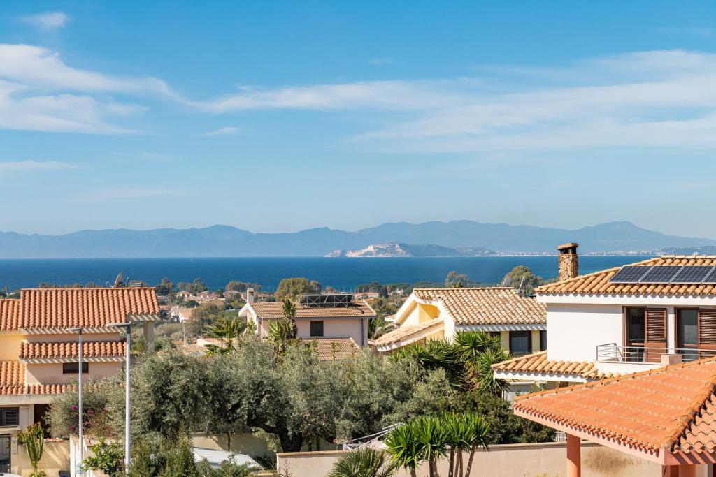 a view of a town with houses and the ocean at Villetta Capitana Vista Mare in Capitana