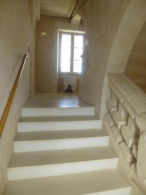 a staircase in a building with a window at Les noisettes in Lhommaizé