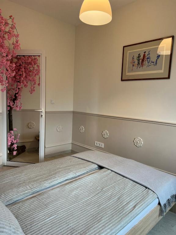 A bed or beds in a room at Vitosha 60